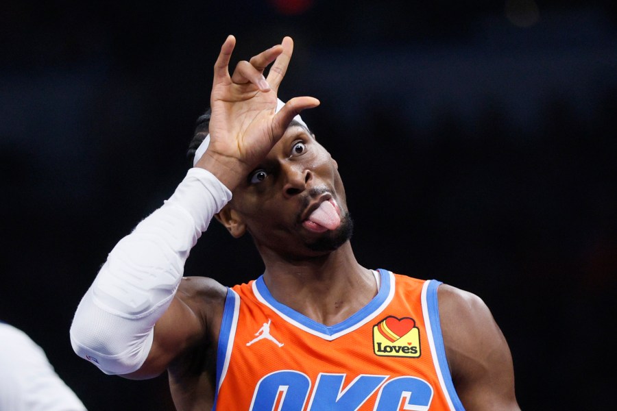 Oklahoma City Thunder guard Shai Gilgeous-Alexander (2) sticks his tongue out while celebrating a 3-pointer during the first half of an Emirates NBA Cup basketball game against the Dallas Mavericks, Tuesday, Dec. 10, 2024, in Oklahoma City. (AP Photo/Nate Billings)