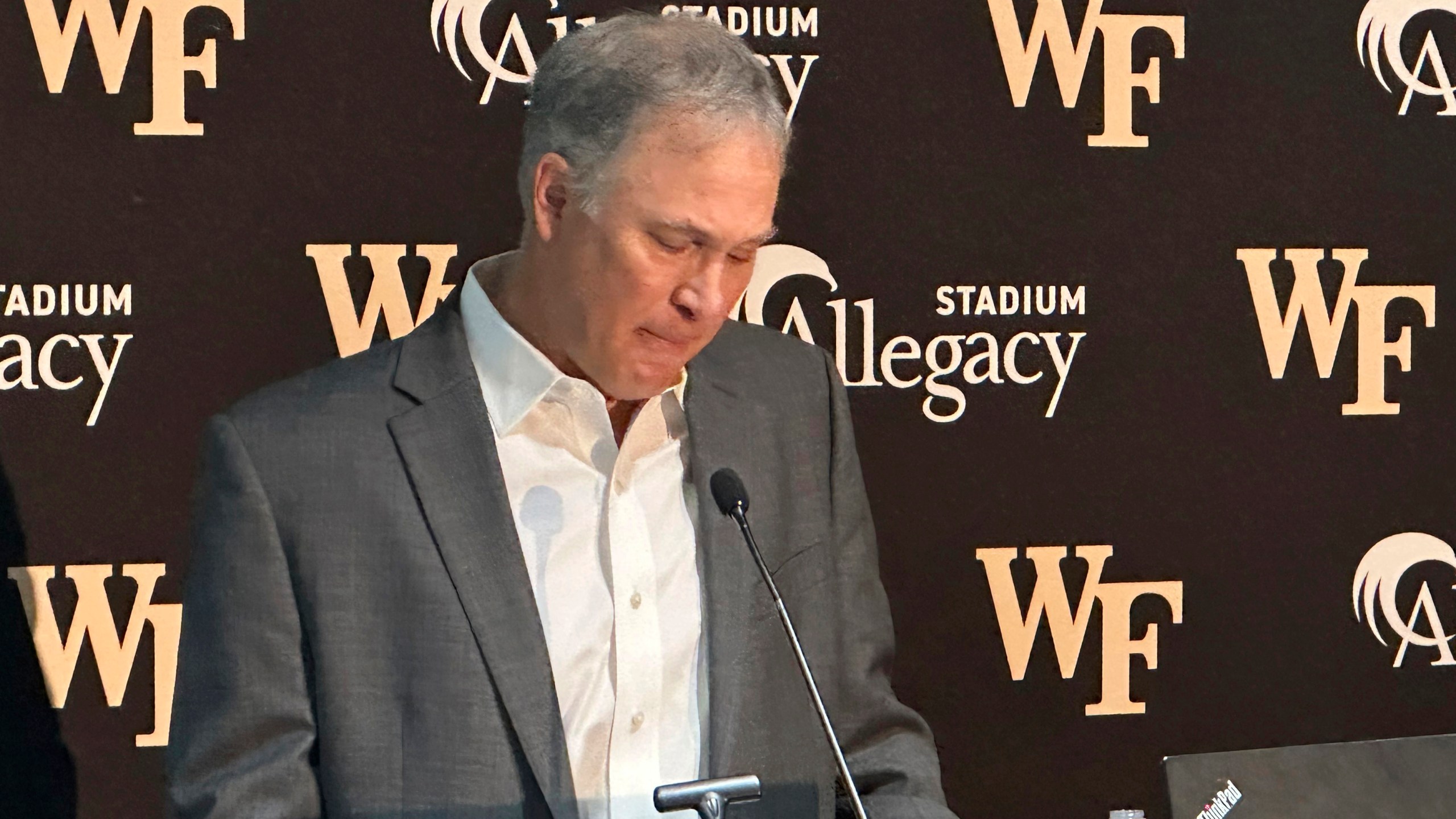 Dave Clawson becomes emotional explaining his decision to resign as head football coach at Wake Forest, Tuesday, Dec. 17, 2024, during an during an NCAA college football news conference in Winston-Salem, N.C. (AP Photo/Aaron Beard)