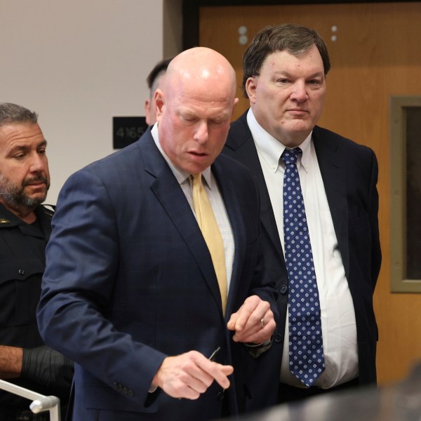 Rex A. Heuermann stands with his lawyer Michael Brown during a court hearing where he was charged with killing Valerie Mack, inside Supreme Court Justice Timothy Mazzei's courtroom at Suffolk County Court in Riverhead, N.Y. on Tuesday, Dec. 17, 2024. (James Carbone/Newsday via AP, Pool)