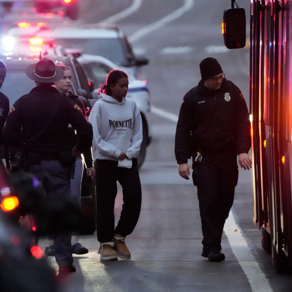 Students aboard a bus as they leave the shelter following a shooting at the Abundant Life Christian School, Monday, Dec. 16, 2024. (AP Photo/Morry Gash)