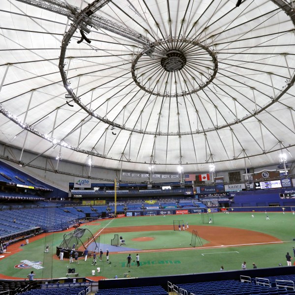 FILE - Members of the Tampa Bay Rays take batting practice at Tropicana Field before a baseball game against the Toronto Blue Jays, July 24, 2020, in St. Petersburg, Fla.. (AP Photo/Chris O'Meara, File)