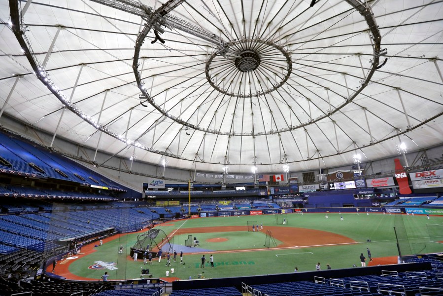 FILE - Members of the Tampa Bay Rays take batting practice at Tropicana Field before a baseball game against the Toronto Blue Jays, July 24, 2020, in St. Petersburg, Fla.. (AP Photo/Chris O'Meara, File)