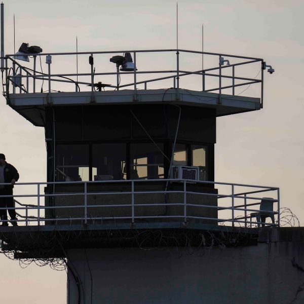 A guard stands in a tower at Indiana State Prison where, barring last-minute court action or intervention by Gov. Eric Holcomb, Joseph Corcoran, 49, convicted in the 1997 killings of his brother and three other people, is scheduled to be put to death by lethal injection before sunrise Tuesday, Dec. 17, 2024, in Michigan City, Ind. (AP Photo/Erin Hooley)