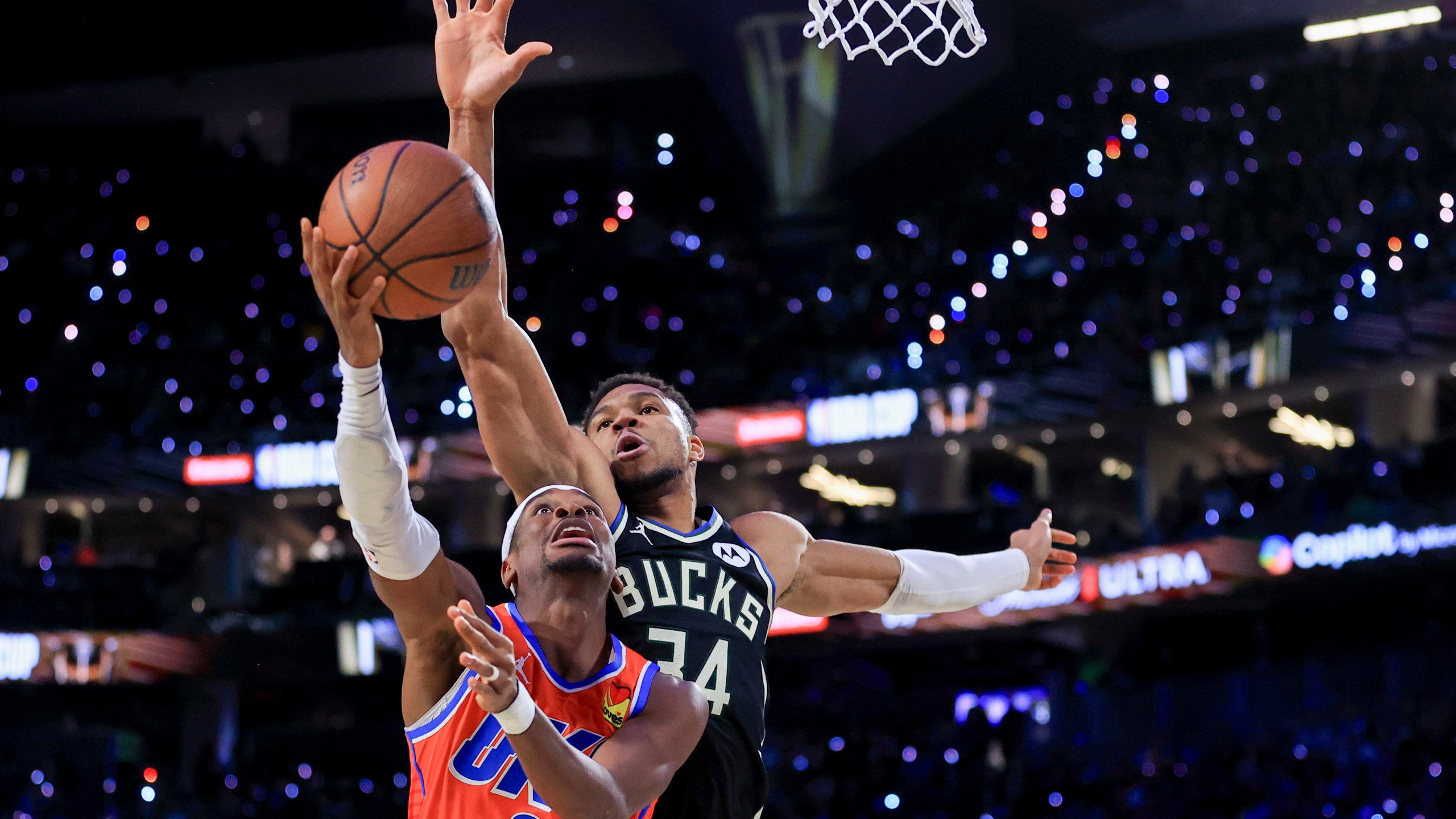 Oklahoma City Thunder guard Shai Gilgeous-Alexander (2) shoots against Milwaukee Bucks forward Giannis Antetokounmpo (34) during the first half of the championship game in the NBA Cup basketball tournament Tuesday, Dec. 17, 2024, in Las Vegas. (AP Photo/Ian Maule)