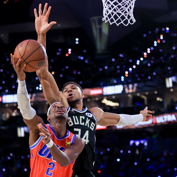 Oklahoma City Thunder guard Shai Gilgeous-Alexander (2) shoots against Milwaukee Bucks forward Giannis Antetokounmpo (34) during the first half of the championship game in the NBA Cup basketball tournament Tuesday, Dec. 17, 2024, in Las Vegas. (AP Photo/Ian Maule)