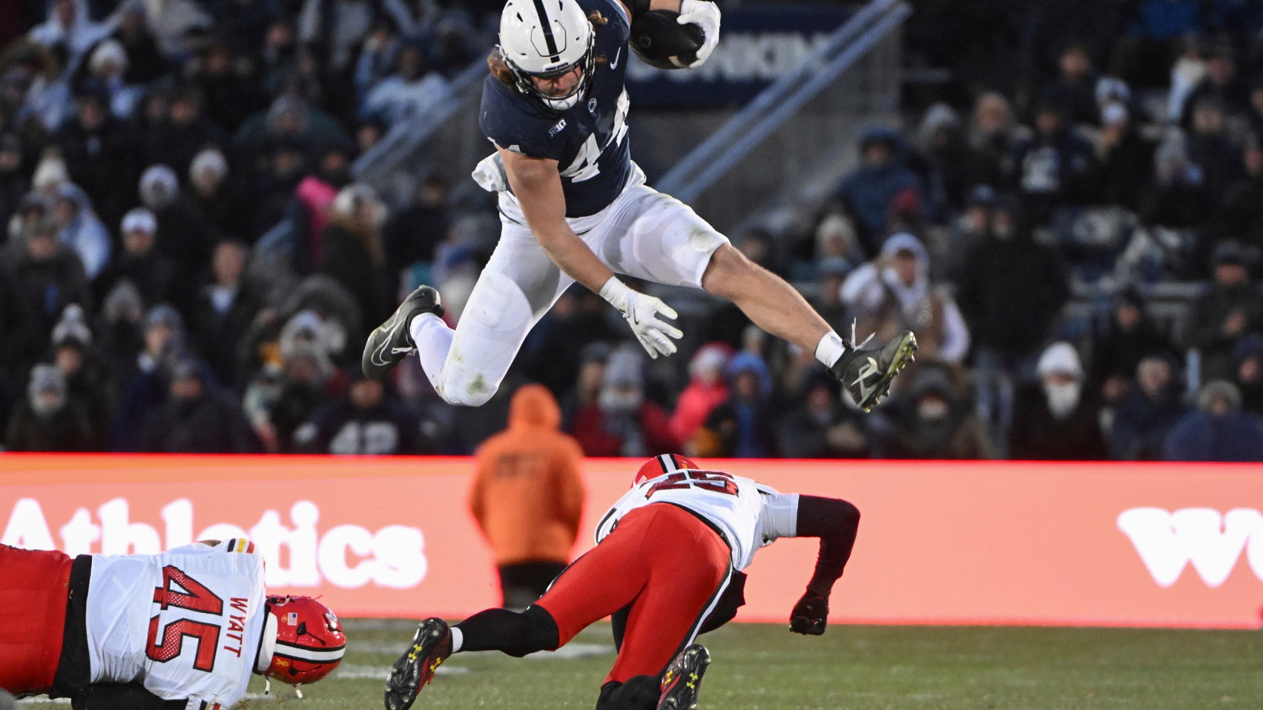 FILE - Penn State tight end Tyler Warren (44) hurdles Maryland defensive back Kevis Thomas (25) during the second quarter of an NCAA college football game, Saturday, Nov. 30, 2024, in State College, Pa. (AP Photo/Barry Reeger, File)