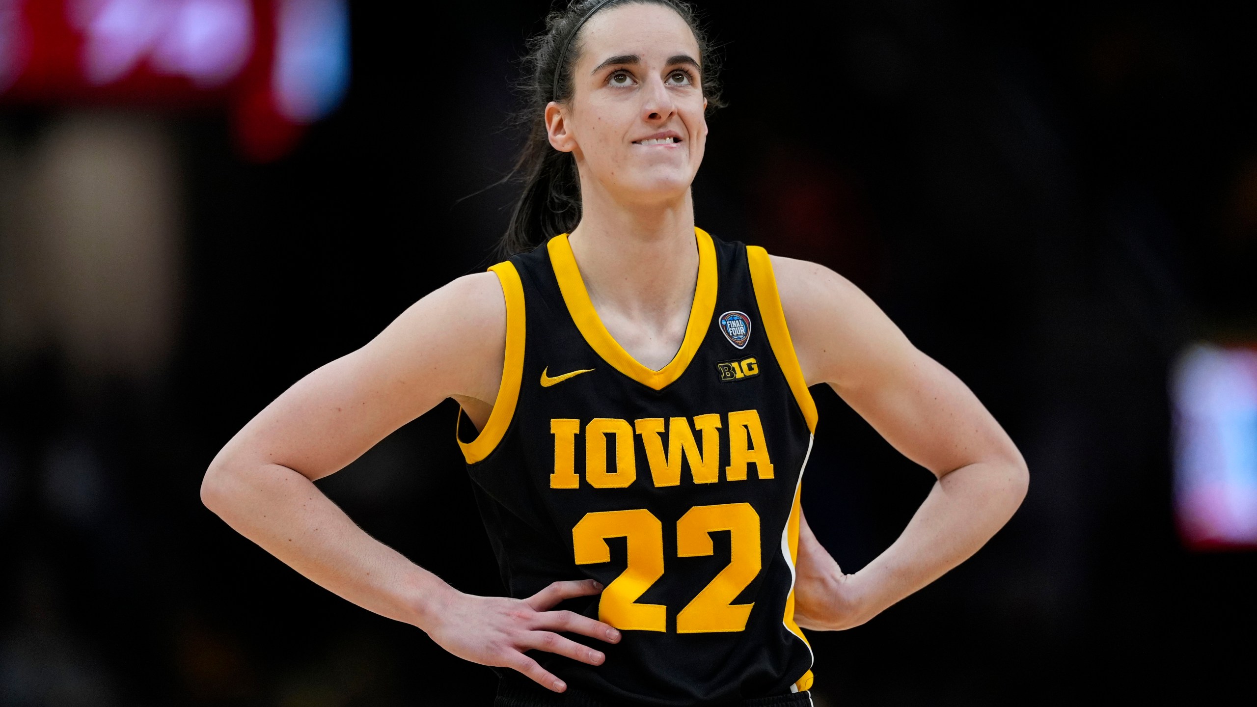 FILE -Iowa guard Caitlin Clark stands on the court during the second half of the Final Four college basketball championship game against South Carolina in the women's NCAA Tournament, Sunday, April 7, 2024, in Cleveland. (AP Photo/Carolyn Kaster, File)