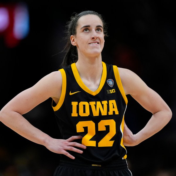 FILE -Iowa guard Caitlin Clark stands on the court during the second half of the Final Four college basketball championship game against South Carolina in the women's NCAA Tournament, Sunday, April 7, 2024, in Cleveland. (AP Photo/Carolyn Kaster, File)