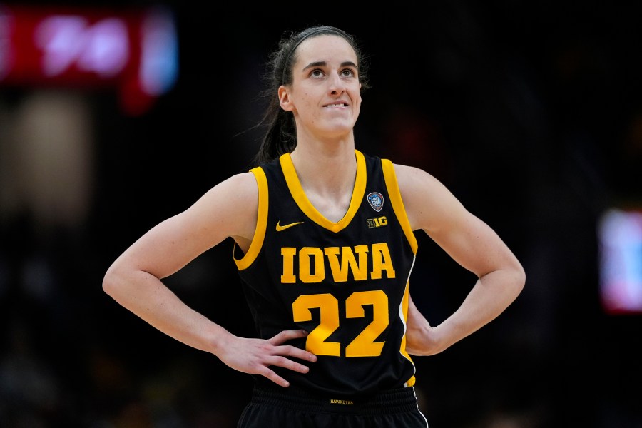 FILE -Iowa guard Caitlin Clark stands on the court during the second half of the Final Four college basketball championship game against South Carolina in the women's NCAA Tournament, Sunday, April 7, 2024, in Cleveland. (AP Photo/Carolyn Kaster, File)