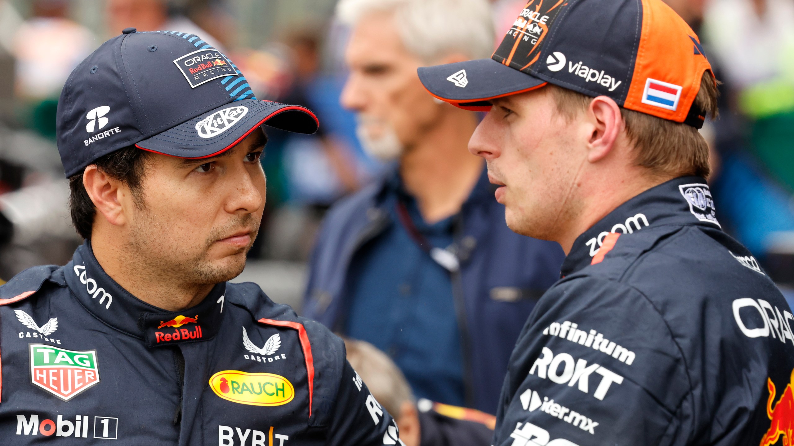 FILE- Red Bull driver Max Verstappen of the Netherlands, right, who clocked the fastest time, speaks with Red Bull driver Sergio Perez of Mexico , who clocked the third fastest time during qualification ahead of the Formula One Grand Prix at the Spa-Francorchamps racetrack in Spa, Belgium, Saturday, July 27, 2024. (AP Photo/Geert Vanden Wijngaert, File0