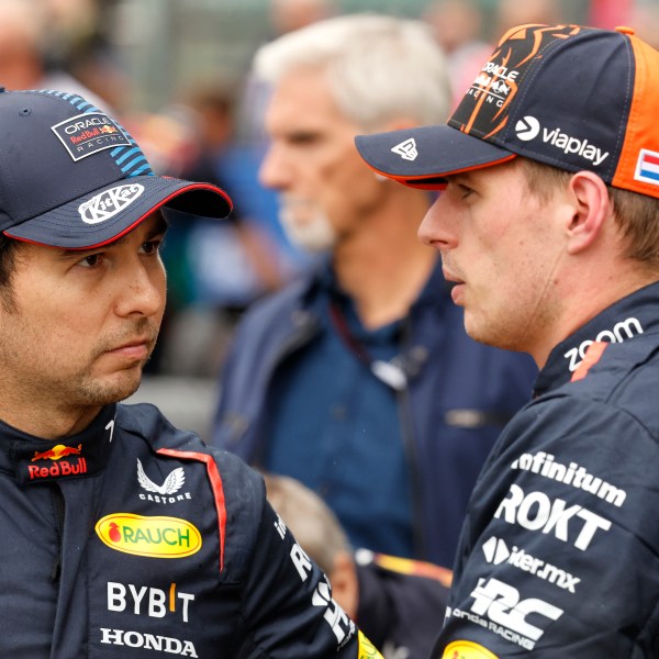 FILE- Red Bull driver Max Verstappen of the Netherlands, right, who clocked the fastest time, speaks with Red Bull driver Sergio Perez of Mexico , who clocked the third fastest time during qualification ahead of the Formula One Grand Prix at the Spa-Francorchamps racetrack in Spa, Belgium, Saturday, July 27, 2024. (AP Photo/Geert Vanden Wijngaert, File0