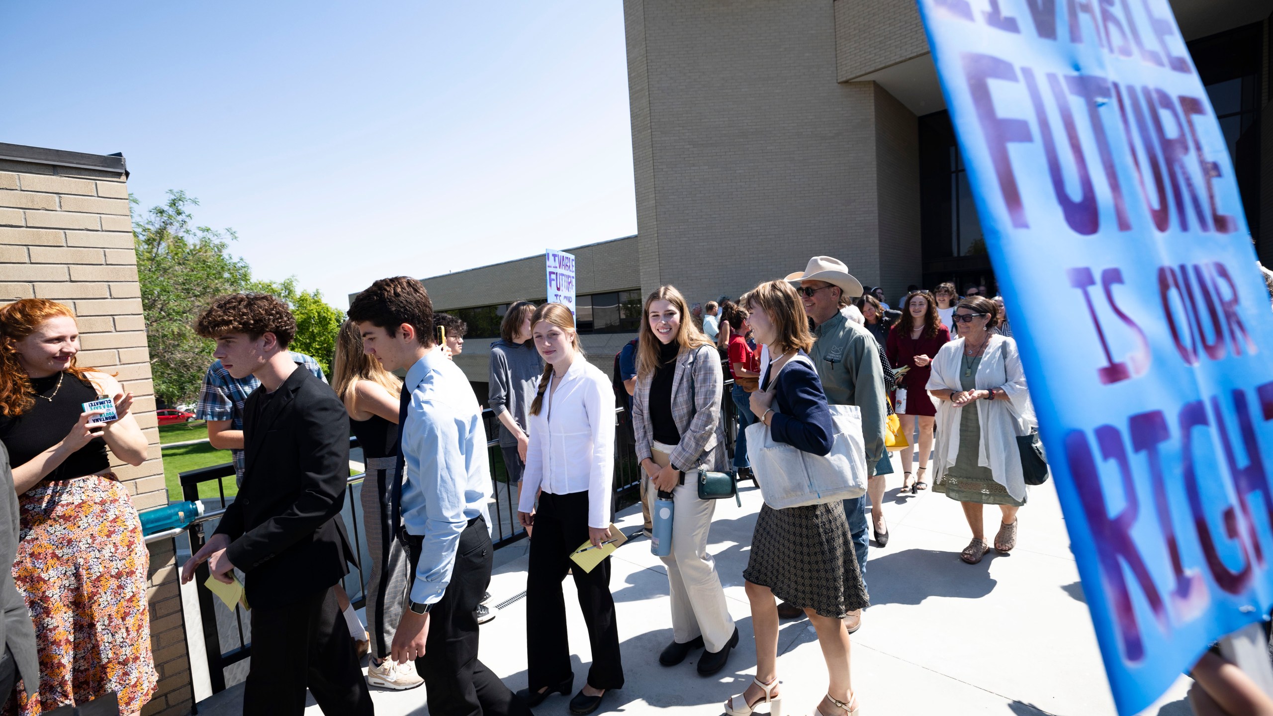 FILE - Youth plaintiffs in the Held v. Montana climate case leave the Montana Supreme Court, on July 10, 2024, in Helena, Mont. (Thom Bridge/Independent Record via AP, File)