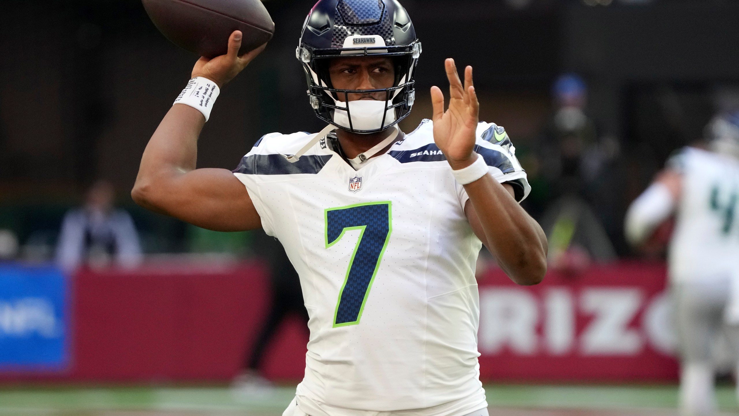 Seattle Seahawks quarterback Geno Smith (7) warms up prior to an NFL football game against the Arizona Cardinals, Sunday, Dec. 8, 2024, in Glendale, Ariz. (AP Photo/Rick Scuteri)