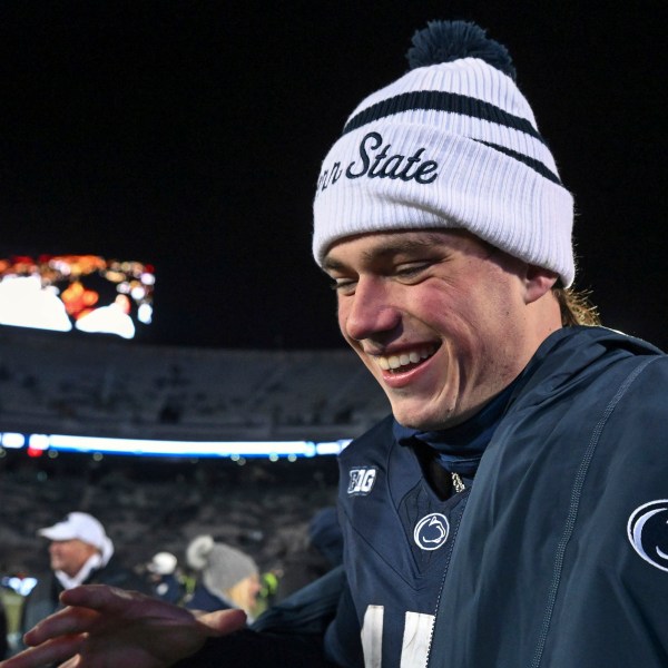 FILE - Penn State quarterback Drew Allar celebrates following a victory over Maryland in an NCAA college football game, Saturday, Nov. 30, 2024, in State College, Pa. (AP Photo/Barry Reeger, File)