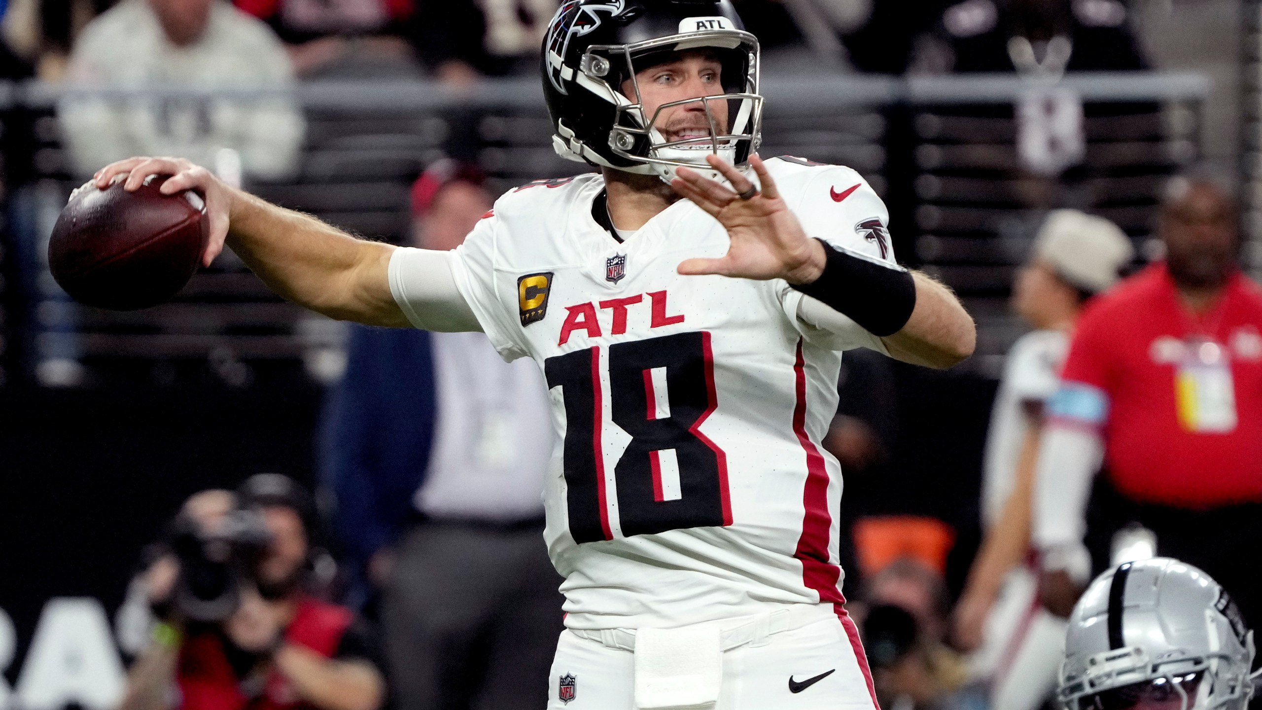 Atlanta Falcons quarterback Kirk Cousins (18) throws against the Las Vegas Raiders during the first half of an NFL football game, Monday, Dec. 16, 2024, in Las Vegas. (AP Photo/Rick Scuteri)