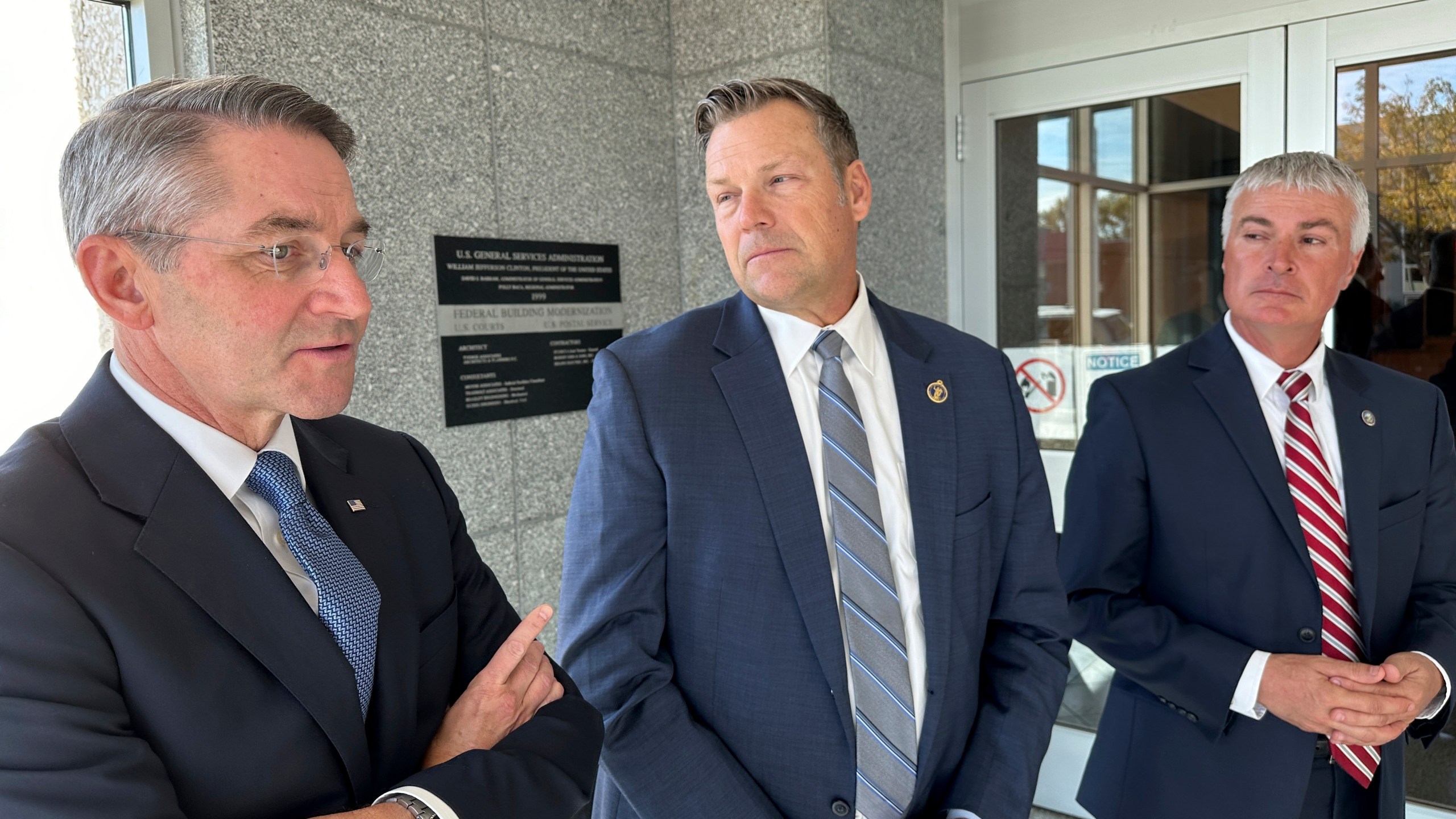 From left, Republican Attorneys General Drew Wrigley of North Dakota, Kris Kobach of Kansas and Marty Jackley of South Dakota speak to reporters after a hearing in federal court in Bismarck, N.D., on Tuesday, Oct. 15, 2024. (AP Photo/Jack Dura)