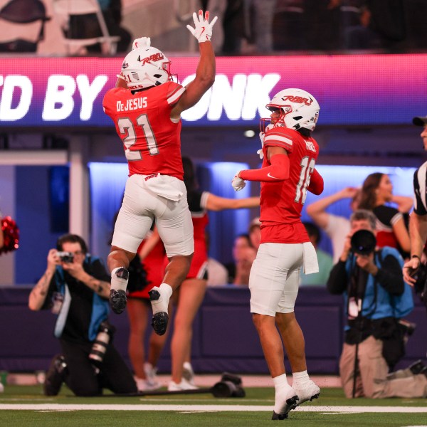 UNLV wide receiver Kayden McGee, right, celebrates his touchdown with wide receiver Jacob De Jesus during the first half of the LA Bowl NCAA college football game against California Wednesday, Dec. 18, 2024, in Inglewood, Calif. (AP Photo/Ryan Sun)