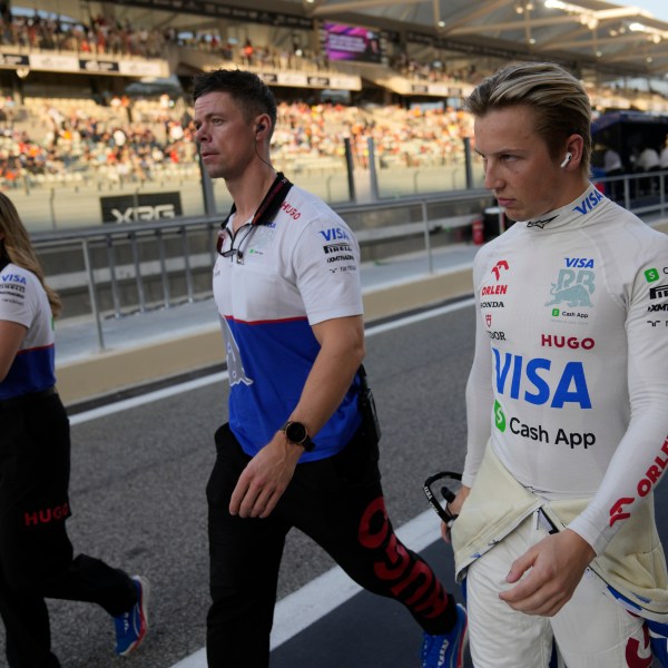 RB driver Liam Lawson of New Zealand walks in the pit lane before the Formula One Abu Dhabi Grand Prix at the Yas Marina Circuit in Abu Dhabi, UAE, Sunday, Dec. 8, 2024. (AP Photo/Darko Bandic)