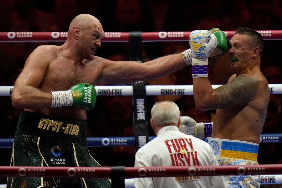 FILE - Britain's Tyson Fury, left, punches Ukraine's Oleksandr Usyk during their undisputed heavyweight world championship boxing fight at the Kingdom Arena in Riyadh, Saudi Arabia, May 19, 2024. (AP Photo/Francisco Seco, File)