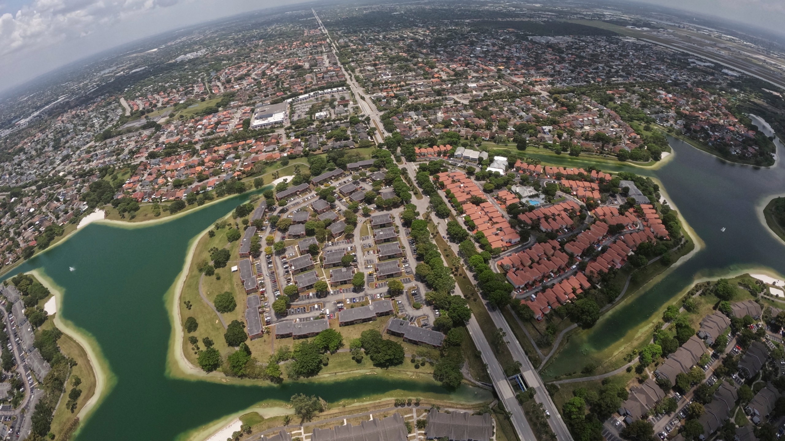 Housing developments are seen amid artificial lakes on the western side of Miami, Friday, May 17, 2024, during a flight donated by LightHawk over parts of the vast Everglades ecosystem in southern Florida. (AP Photo/Rebecca Blackwell)