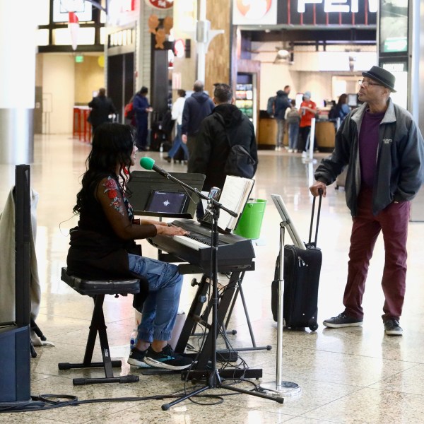 Roz McCommon performs at Seattle-Tacoma International Airport on November 26, 2024, in SeaTac, Wash. (AP Photo/Manuel Valdes)