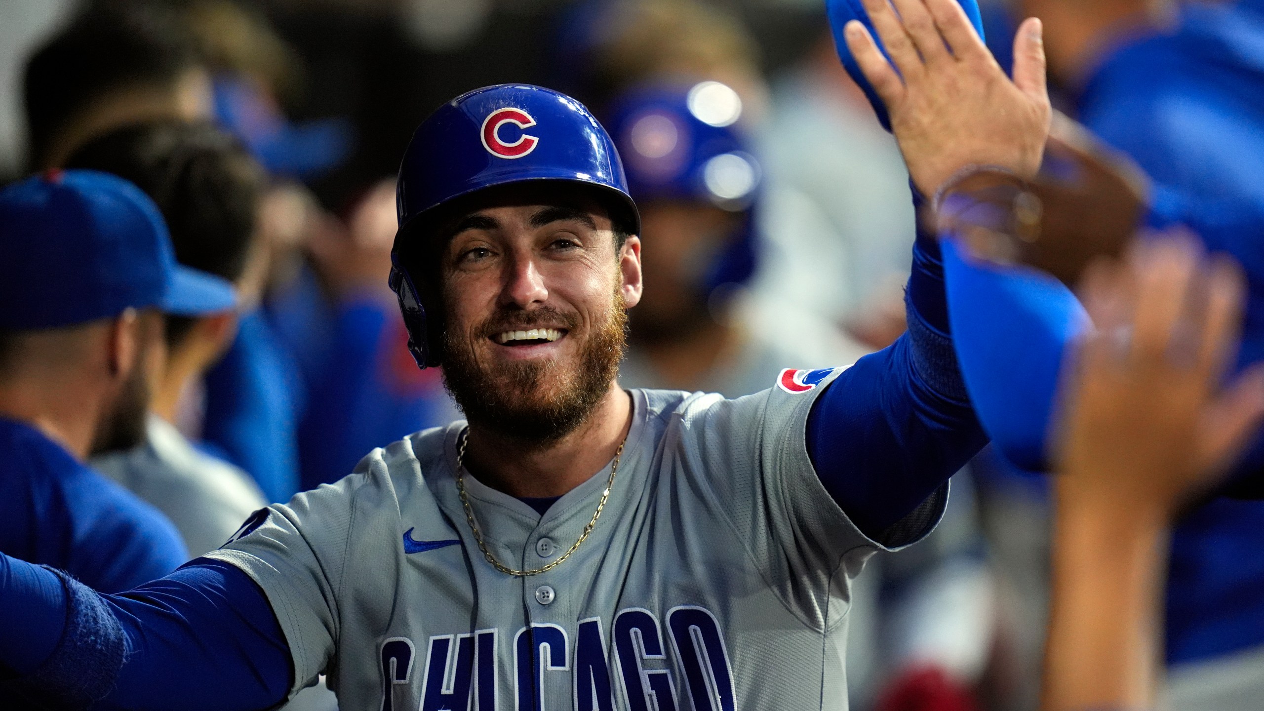 FILE - Chicago Cubs' Cody Bellinger celebrates after scoring on a home run by Isaac Paredes during the third inning of a baseball game against the Chicago White Sox, Friday, Aug. 9, 2024, in Chicago. (AP Photo/Erin Hooley, File)