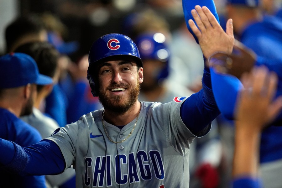 FILE - Chicago Cubs' Cody Bellinger celebrates after scoring on a home run by Isaac Paredes during the third inning of a baseball game against the Chicago White Sox, Friday, Aug. 9, 2024, in Chicago. (AP Photo/Erin Hooley, File)