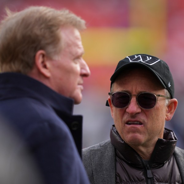 FILE - Washington Commanders managing partner Josh Harris, right, speaks with league commissioner Roger Goodell before an NFL football game against the Tennessee Titans, Sunday, Dec. 1, 2024, in Landover, Md. (AP Photo/Matt Slocum, File)