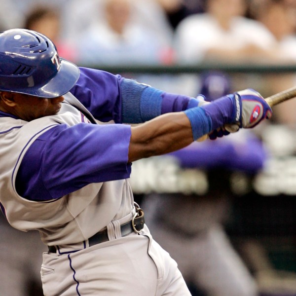 FILE - Texas Rangers' Sammy Sosa singles against the Seattle Mariners in the fourth inning at a baseball game, Thursday, May 31, 2007, in Seattle. (AP Photo/Elaine Thompson, File)