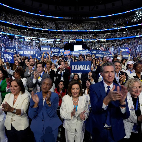 FILE - Rep. Nancy Pelosi, D-Calif., center, and California Gov. Gavin Newsom, center right, applaud as Democratic presidential nominee Vice President Kamala Harris speaks during the Democratic National Convention, in Chicago, Aug. 22, 2024. (AP Photo/Paul Sancya, File)