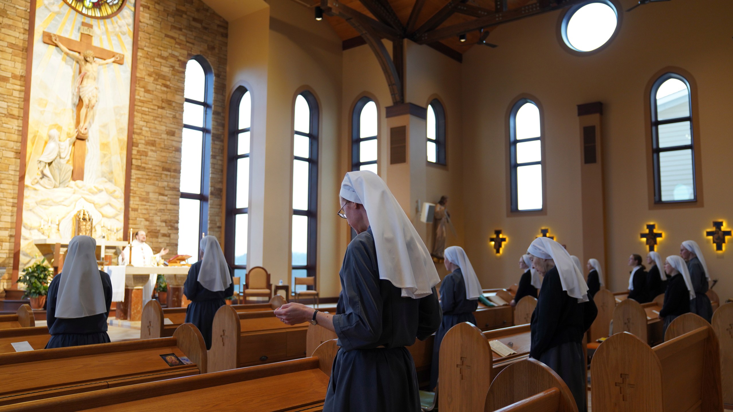 The Franciscan Sisters, T.O.R. of Penance of the Sorrowful Mother stand during Mass in Toronto, Ohio, Thursday, Nov. 7, 2024. (AP Photo/Jessie Wardarski)