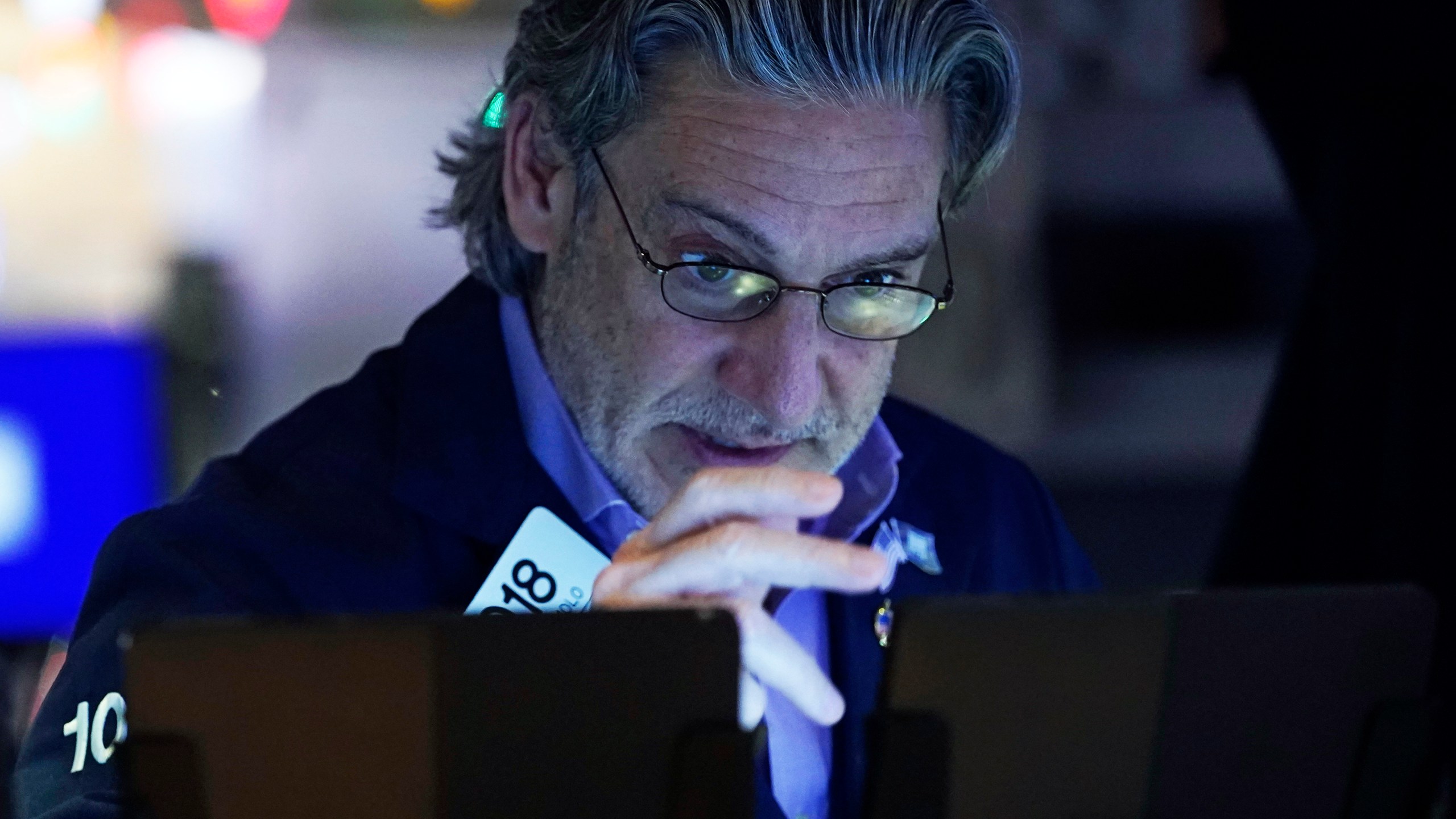 Trader John Romolo works on the floor of the New York Stock Exchange, Wednesday, Dec. 18, 2024. (AP Photo/Richard Drew)