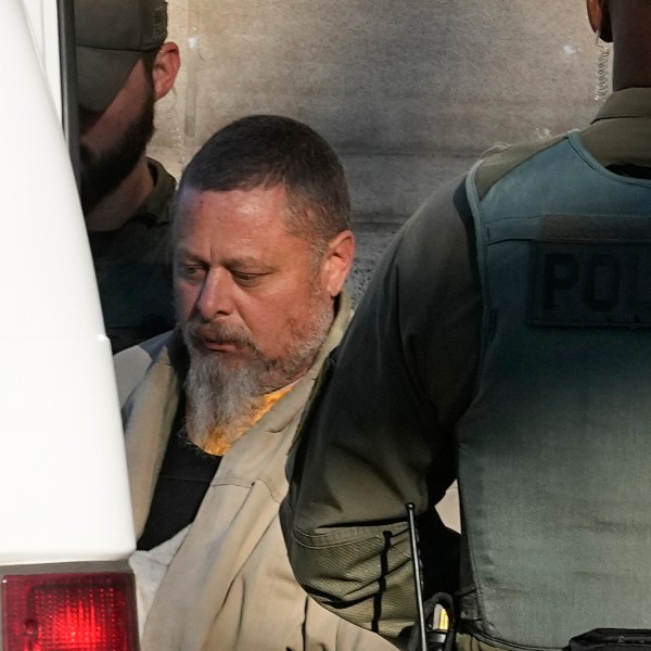 FILE - Officers escort Richard Allen out of the Carroll County Courthouse following a hearing, Nov. 22, 2022, in Delphi, Ind. (AP Photo/Darron Cummings, File)