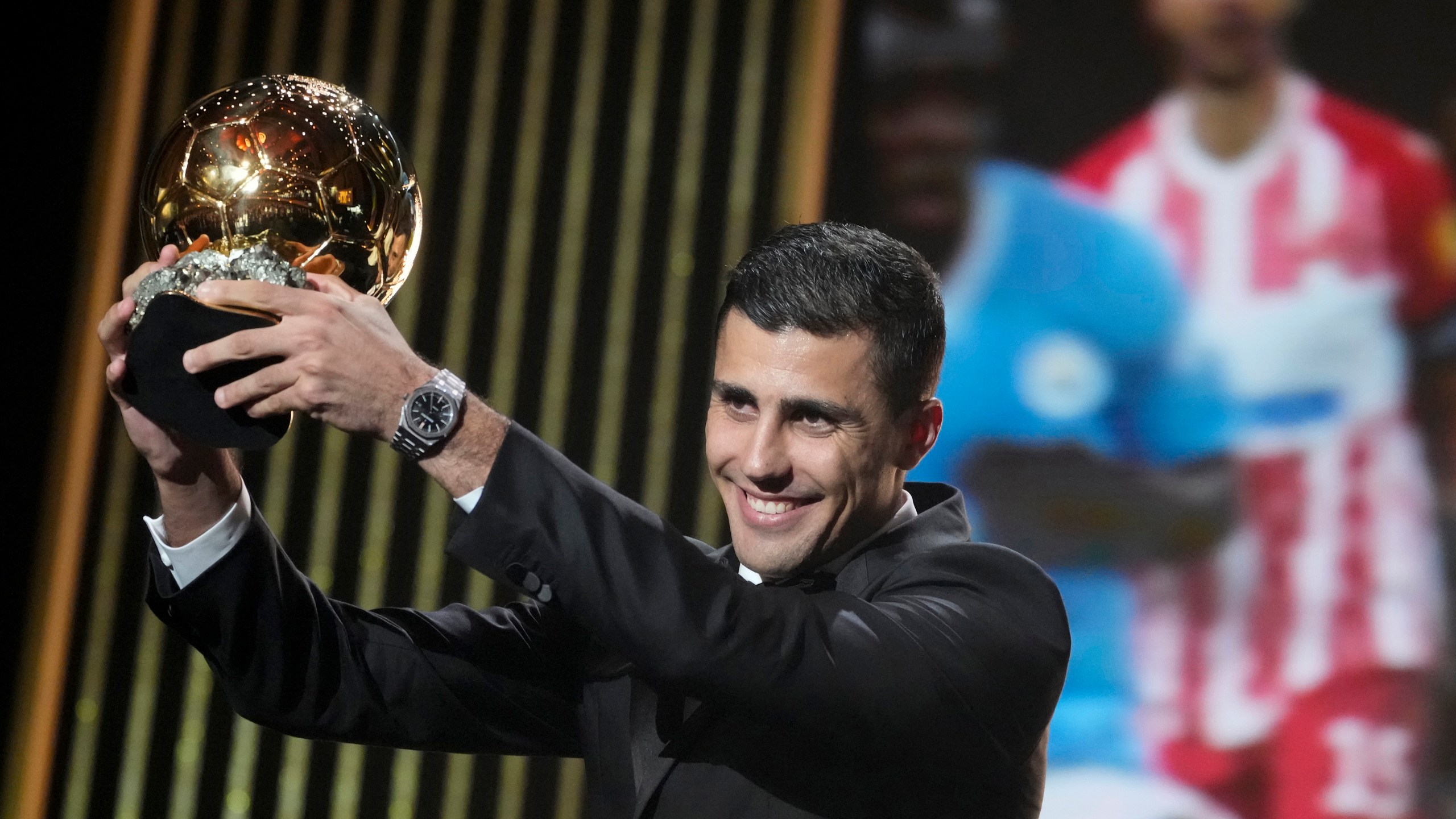 FILE - Manchester City's Spanish player Rodri receives the 2024 Men's Ballon d'Or award during the 68th Ballon d'Or (Golden Ball) award ceremony at Theatre du Chatelet in Paris, Monday, Oct. 28, 2024. (AP Photo/Michel Euler, File)