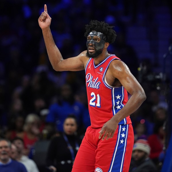 Philadelphia 76ers' Joel Embiid reacts after being fouled during the first half of an NBA basketball game against the Charlotte Hornets, Friday, Dec. 20, 2024, in Philadelphia. (AP Photo/Matt Slocum)