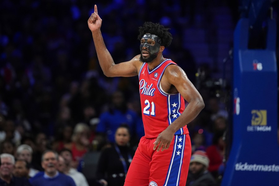 Philadelphia 76ers' Joel Embiid reacts after being fouled during the first half of an NBA basketball game against the Charlotte Hornets, Friday, Dec. 20, 2024, in Philadelphia. (AP Photo/Matt Slocum)