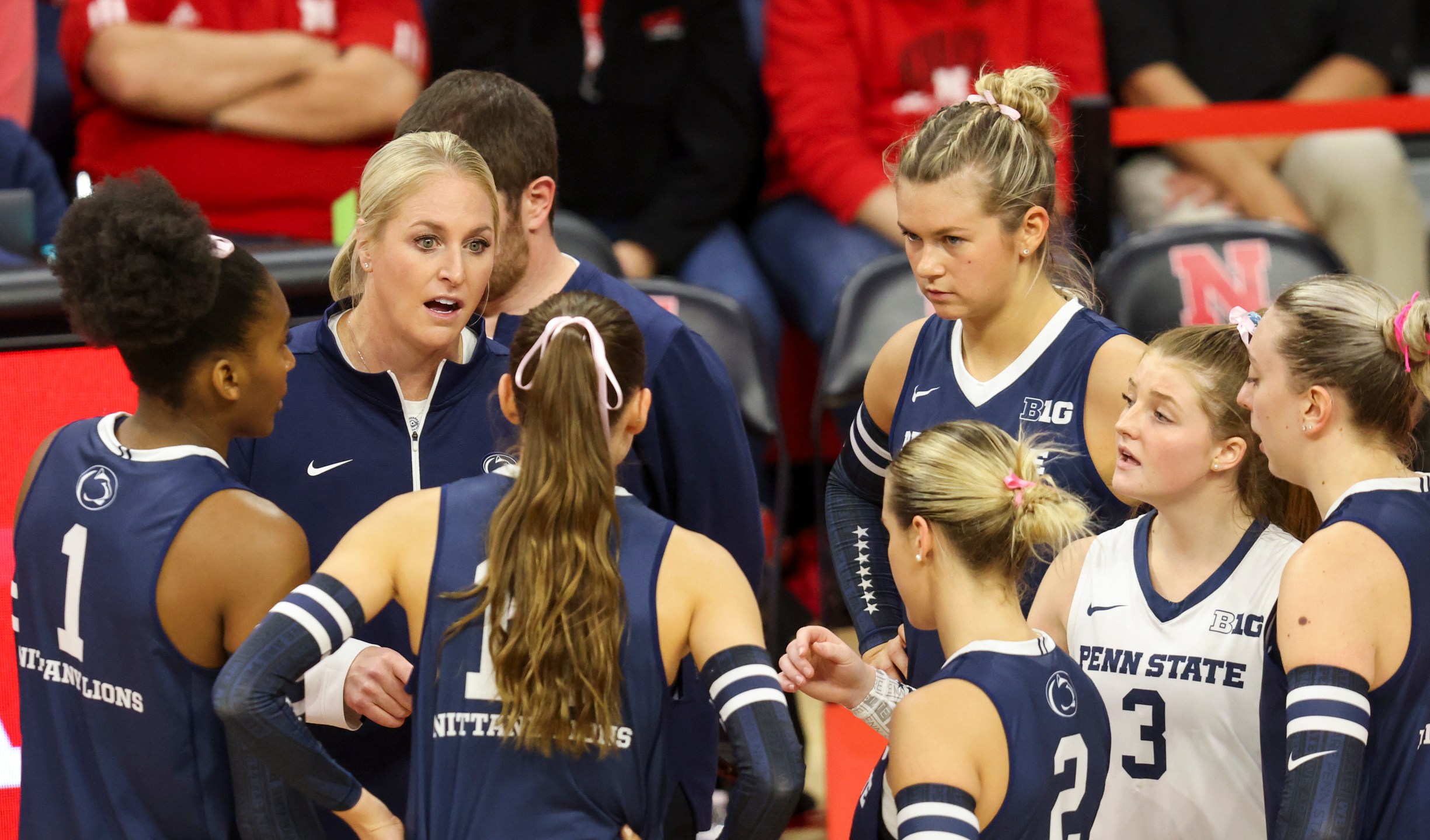 FILE -Penn State head coach Katie Schumacher-Cawley, second from left, talks with her team during a timeout during the first set of an NCAA college volleyball match against Nebraska, Saturday, Oct. 14, 2023, in Lincoln, Neb. (Nikos Frazier/Omaha World-Herald via AP, File)