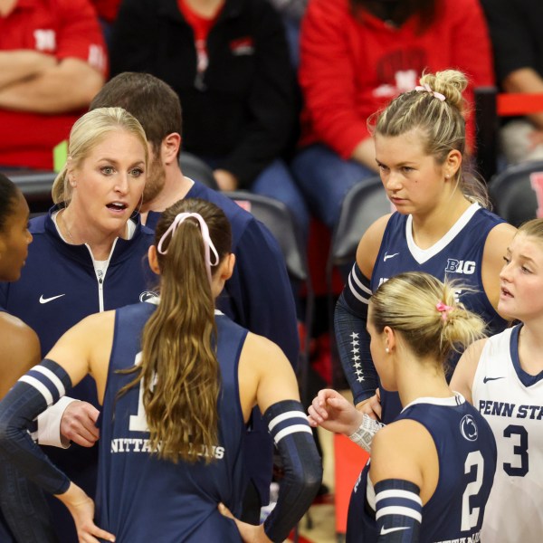 FILE -Penn State head coach Katie Schumacher-Cawley, second from left, talks with her team during a timeout during the first set of an NCAA college volleyball match against Nebraska, Saturday, Oct. 14, 2023, in Lincoln, Neb. (Nikos Frazier/Omaha World-Herald via AP, File)