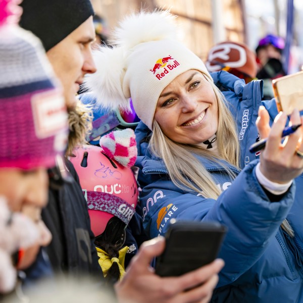 United States' Lindsey Vonn, takes a selfie in the finish area after completing an alpine ski, women's World Cup super G, in St. Moritz, Switzerland, Saturday, Dec. 21, 2024. (Jean-Christophe Bott/Keystone via AP)