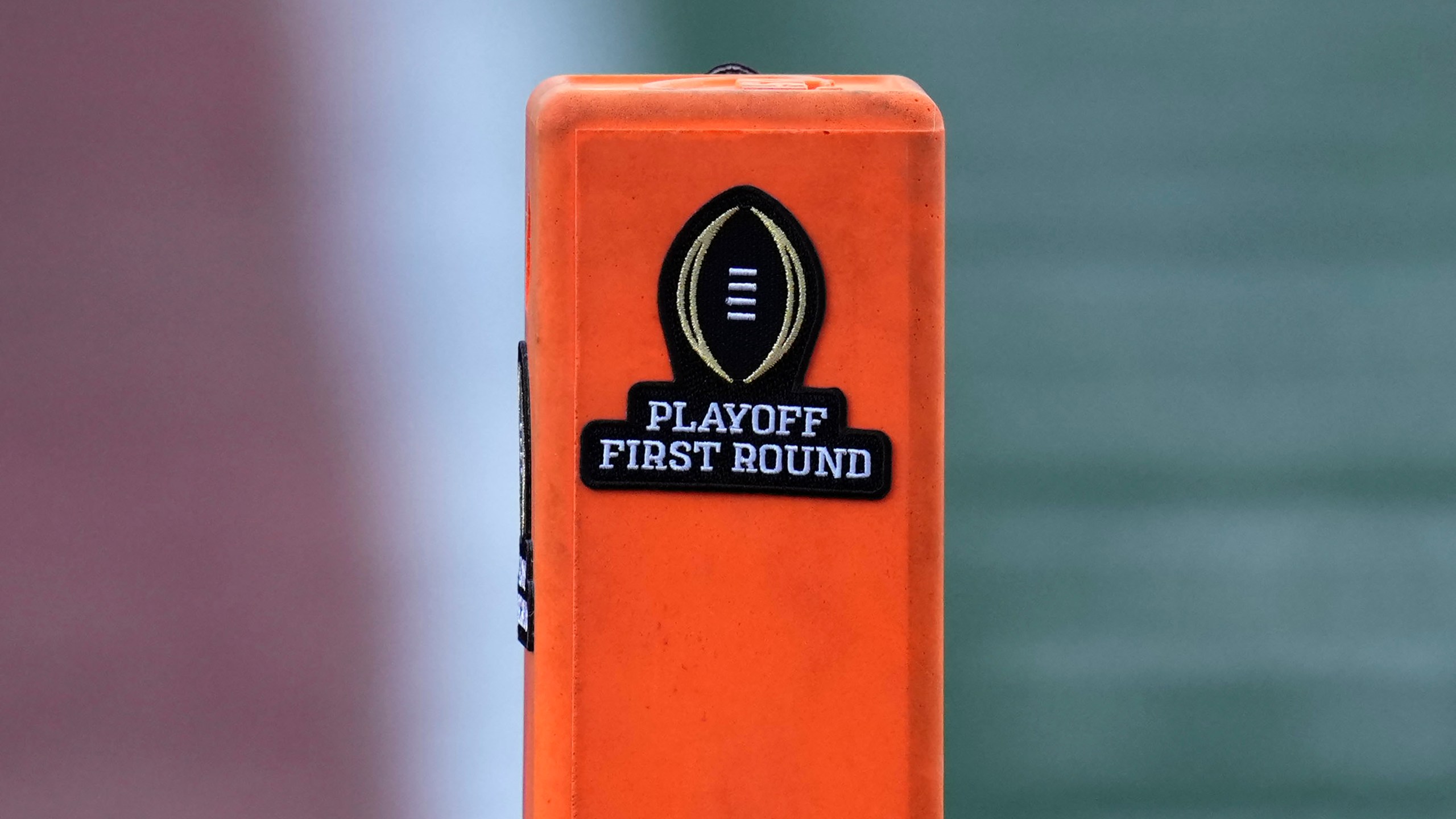 A playoff logo is seen on an end zone marker during the first half between Texas and Clemson in the first round of the College Football Playoff, Saturday, Dec. 21, 2024, in Austin, Texas. (AP Photo/Eric Gay)