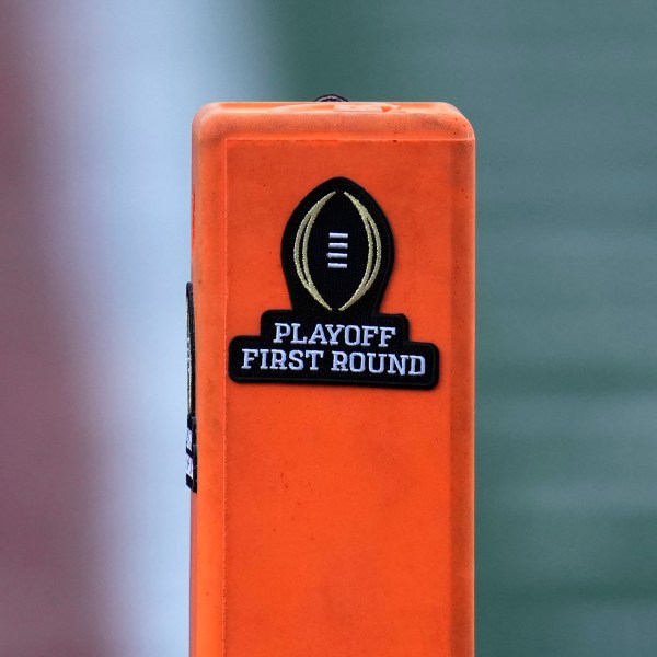 A playoff logo is seen on an end zone marker during the first half between Texas and Clemson in the first round of the College Football Playoff, Saturday, Dec. 21, 2024, in Austin, Texas. (AP Photo/Eric Gay)