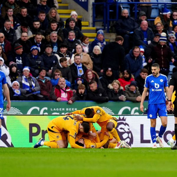 Wolverhampton Wanderers' Goncalo Guedes celebrates scoring his side's first goal of the game with teammates, during the English Premier League soccer match between Leicester City and Wolverhampton Wanderers at King Power Stadium, in Leicester, England, Sunday, Dec. 22, 2024. (Mike Egerton/PA via AP)