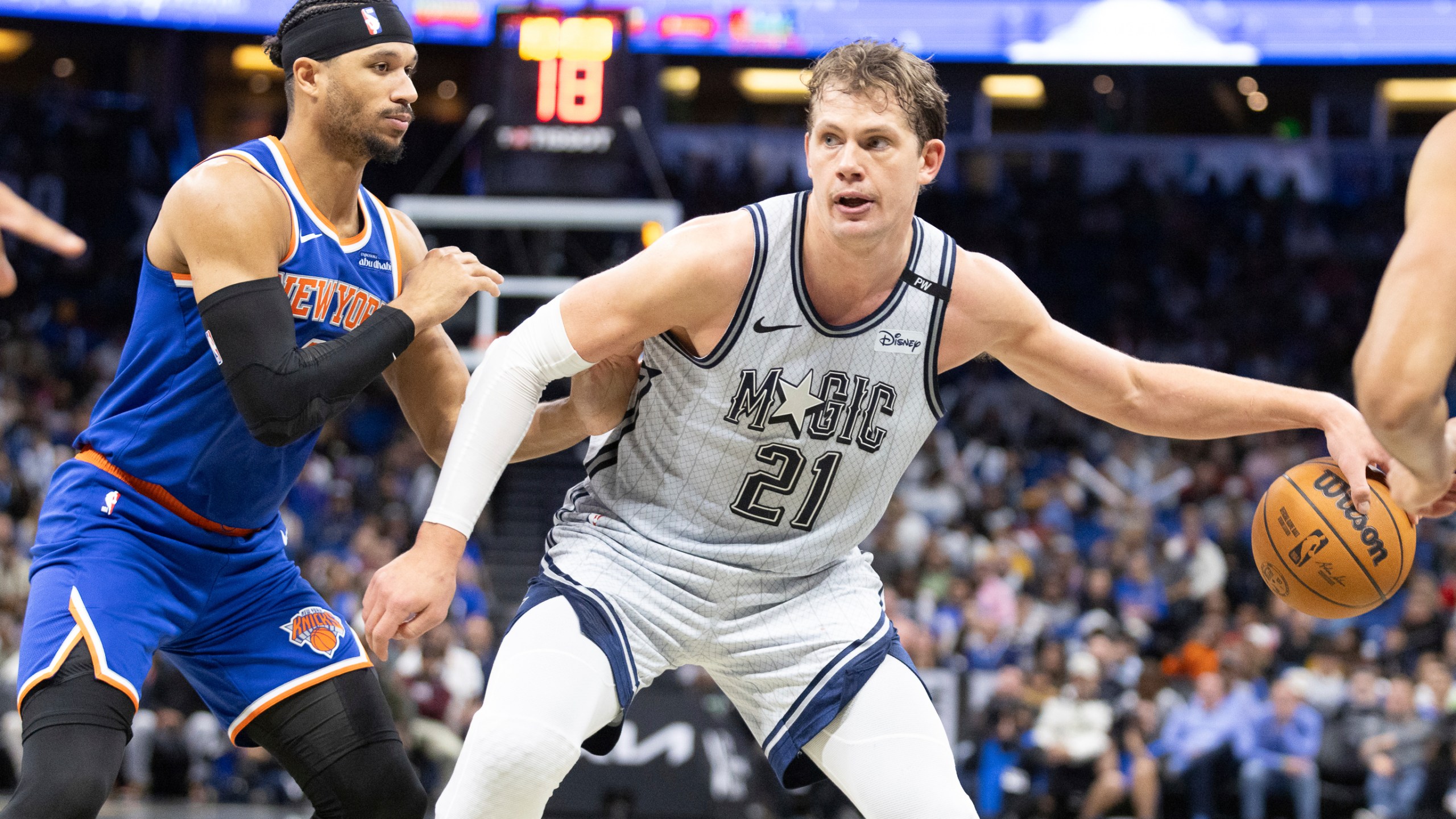 Orlando Magic center Moritz Wagner (21) evades New York Knicks guard Pacome Dadiet, left, during the second half of an NBA basketball game Sunday, Dec. 15, 2024, in Orlando, Fla. (AP Photo/Alan Youngblood)