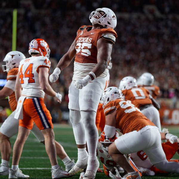 Texas defensive lineman Alfred Collins (95) celebrates after a defensive stop during the second half against Clemson in the first round of the College Football Playoff, Saturday, Dec. 21, 2024, in Austin, Texas. (AP Photo/Eric Gay)