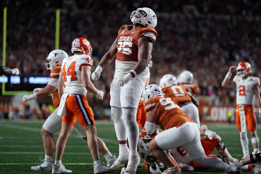 Texas defensive lineman Alfred Collins (95) celebrates after a defensive stop during the second half against Clemson in the first round of the College Football Playoff, Saturday, Dec. 21, 2024, in Austin, Texas. (AP Photo/Eric Gay)