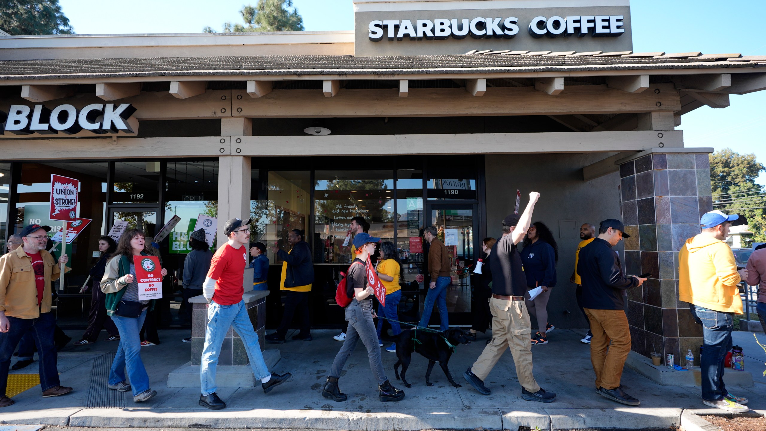 Starbucks baristas and other workers start a five-day strike to protest a lack of progress in contract negotiations with the company Friday, Dec. 20, 2024, in Burbank, Calif. (AP Photo/Damian Dovarganes)