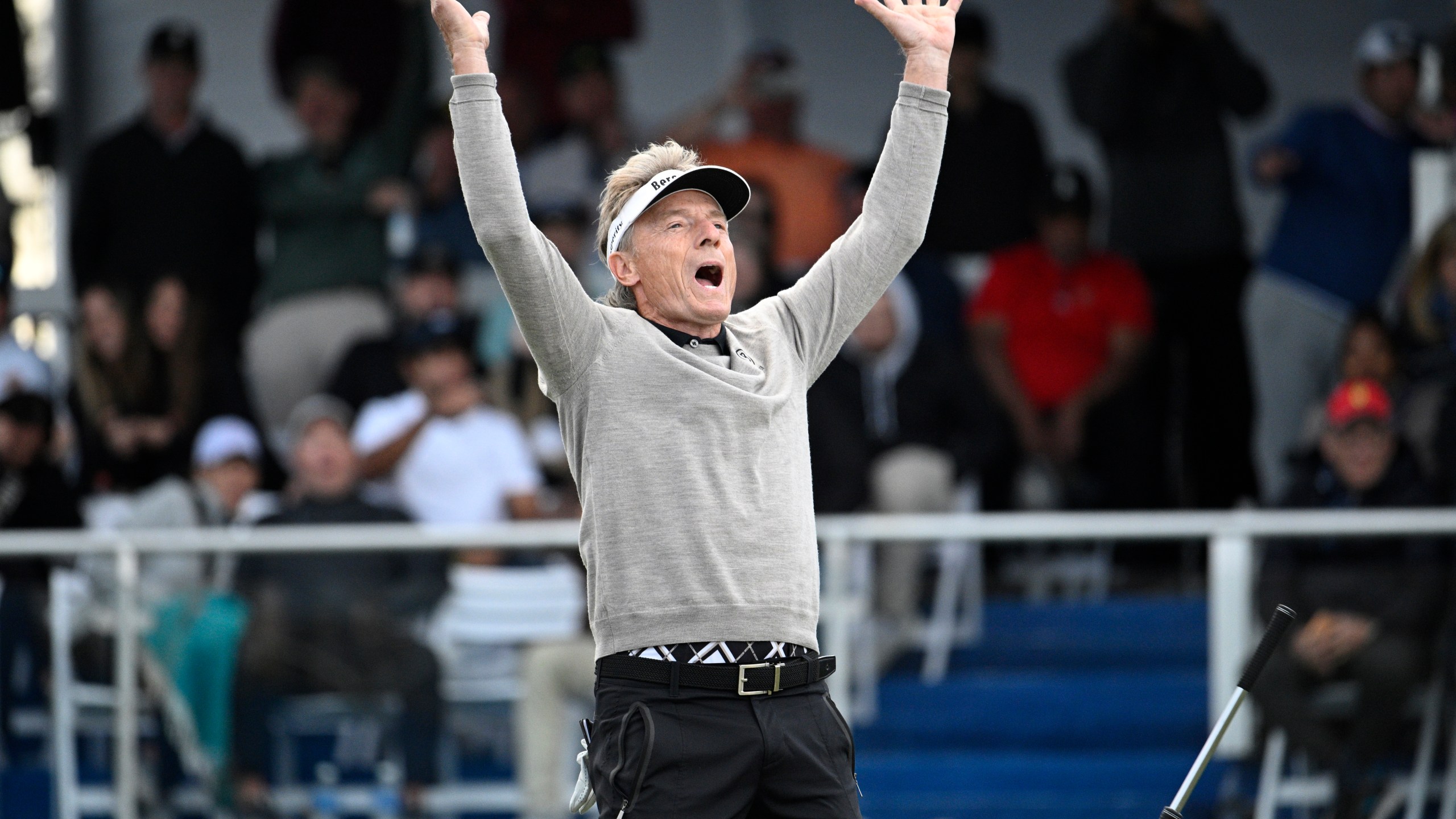 Bernhard Langer reacts after making a putt during a playoff hole on the 18th green to win the PNC Championship golf tournament, Sunday, Dec. 22, 2024, in Orlando, Fla. (AP Photo/Phelan M. Ebenhack)