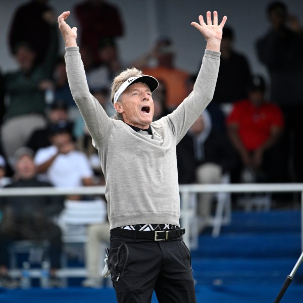 Bernhard Langer reacts after making a putt during a playoff hole on the 18th green to win the PNC Championship golf tournament, Sunday, Dec. 22, 2024, in Orlando, Fla. (AP Photo/Phelan M. Ebenhack)