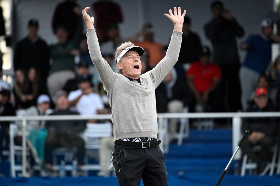 Bernhard Langer reacts after making a putt during a playoff hole on the 18th green to win the PNC Championship golf tournament, Sunday, Dec. 22, 2024, in Orlando, Fla. (AP Photo/Phelan M. Ebenhack)