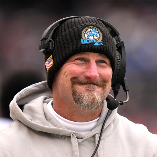 Detroit Lions head coach Dan Campbell smiles along the sidelines during the first half of an NFL football game against the Chicago Bears on Sunday, Dec. 22, 2024, in Chicago. (AP Photo/Erin Hooley)